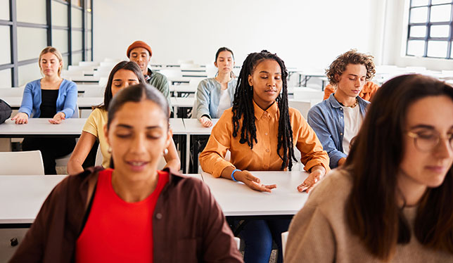 Students meditating in class