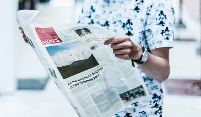 Person reading newspaper