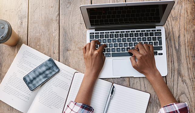 female student using her laptop