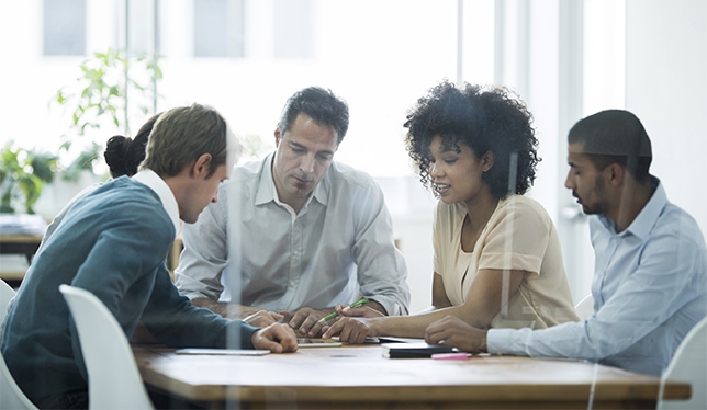 Cropped shot of a group of business colleagues meeting in the boardroom